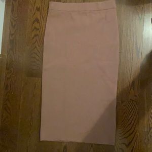 Babaton knee length skirt in blush pink. size L.
